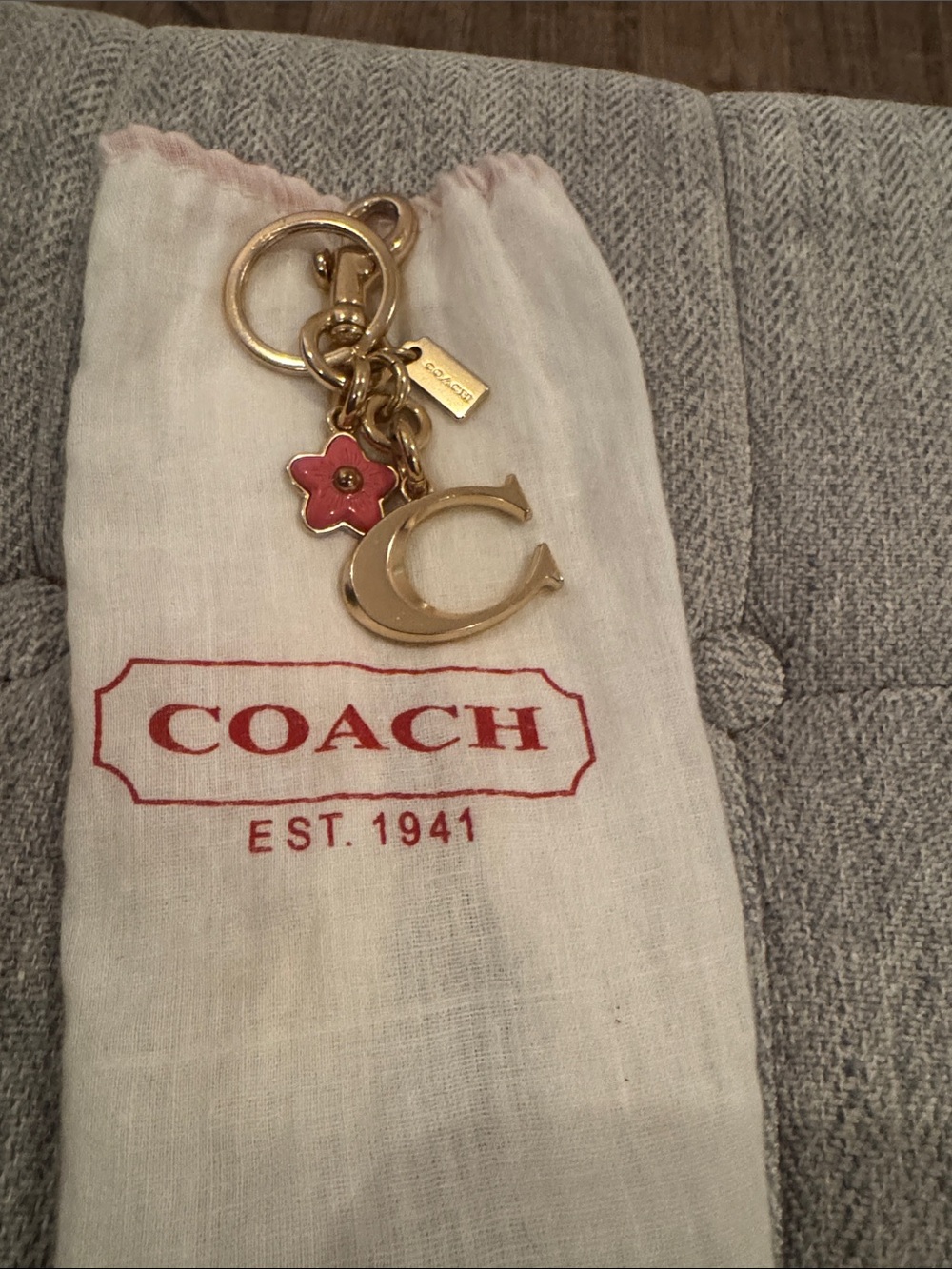 NWOT, Coach vintage gold “C” key fob/ bag charm in gold .